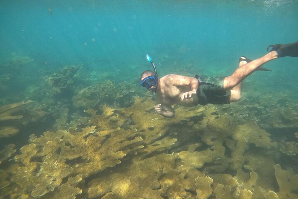 a man laying in the water in the ocean
