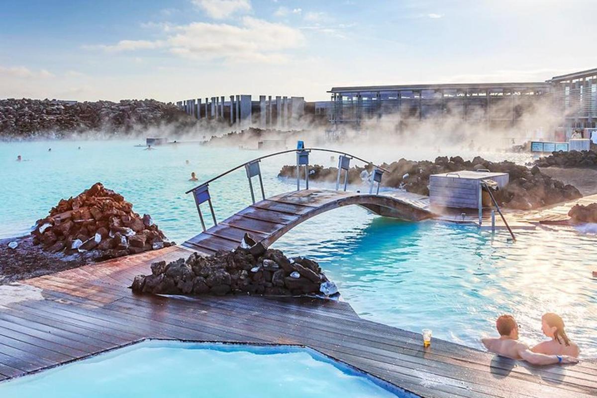 a pool of water with a bridge and people in it