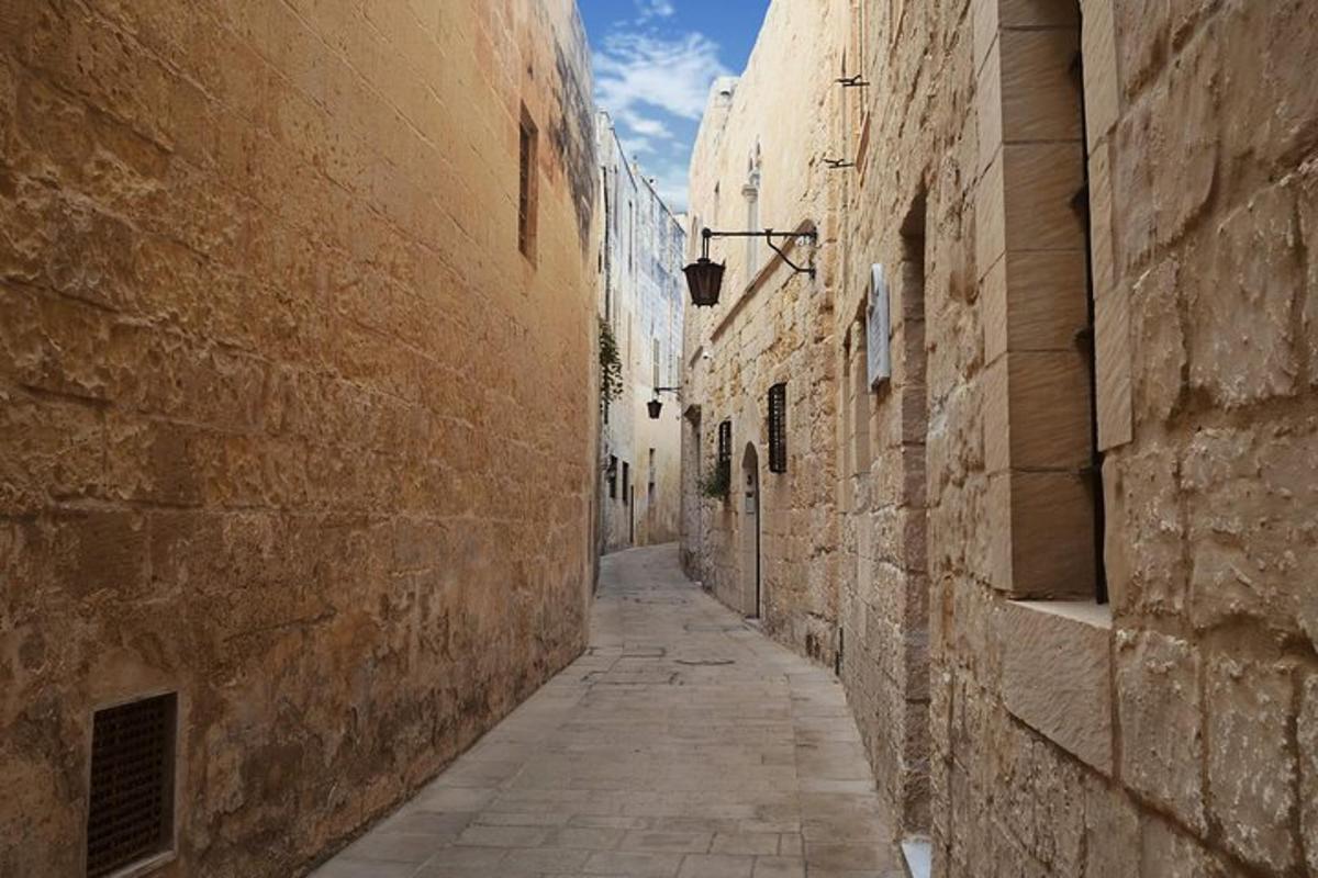 an alley between two buildings in an old town