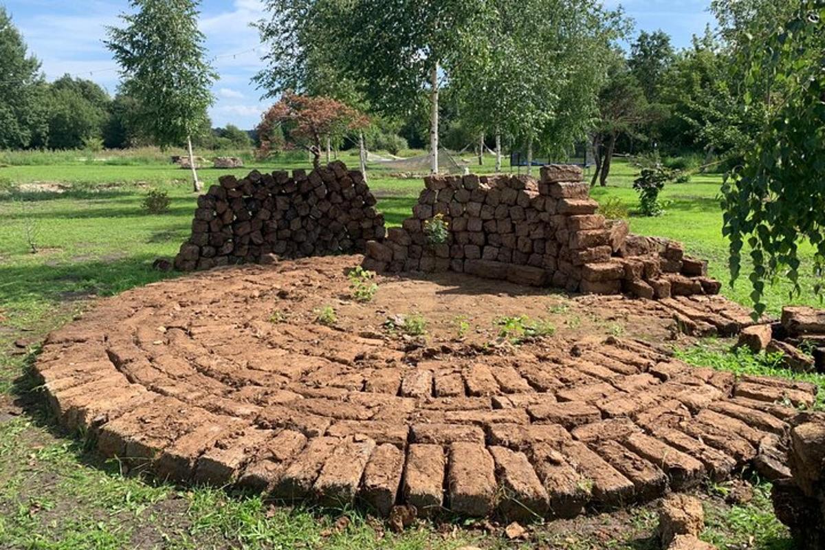 a large pile of bricks in a field