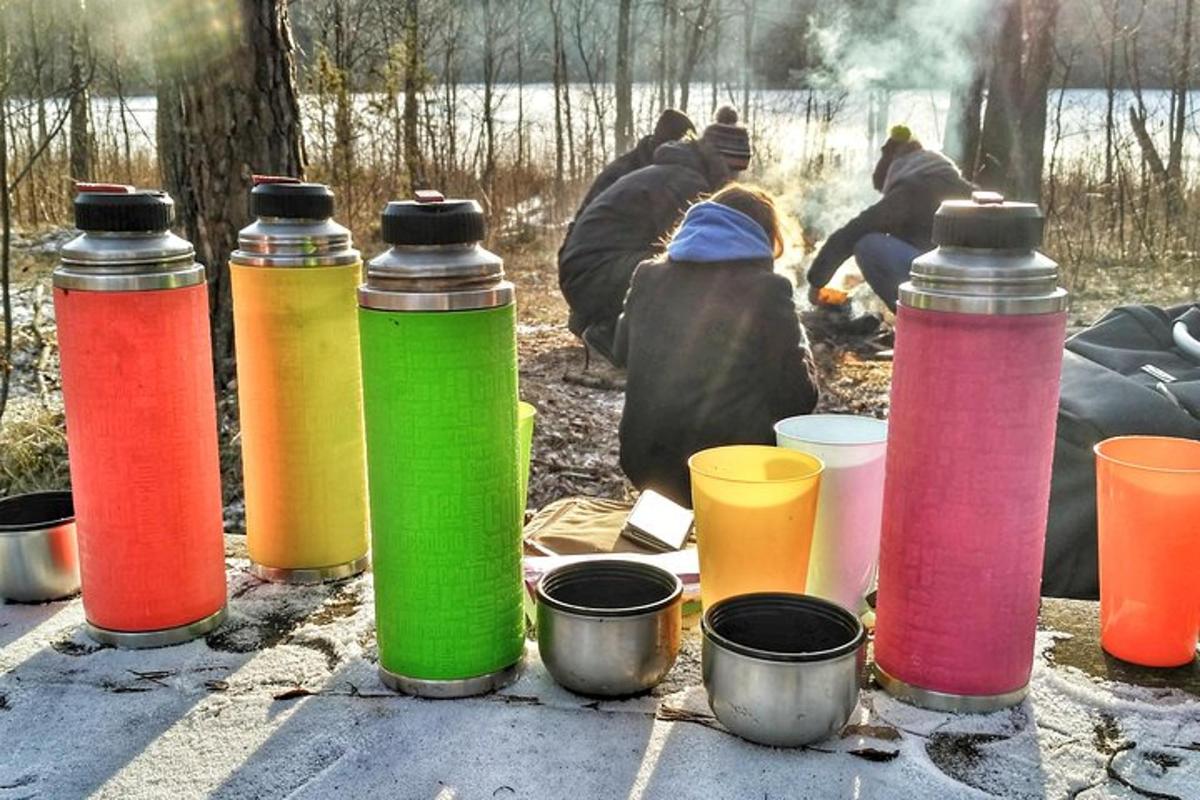 a group of different colored bottles sitting on a table