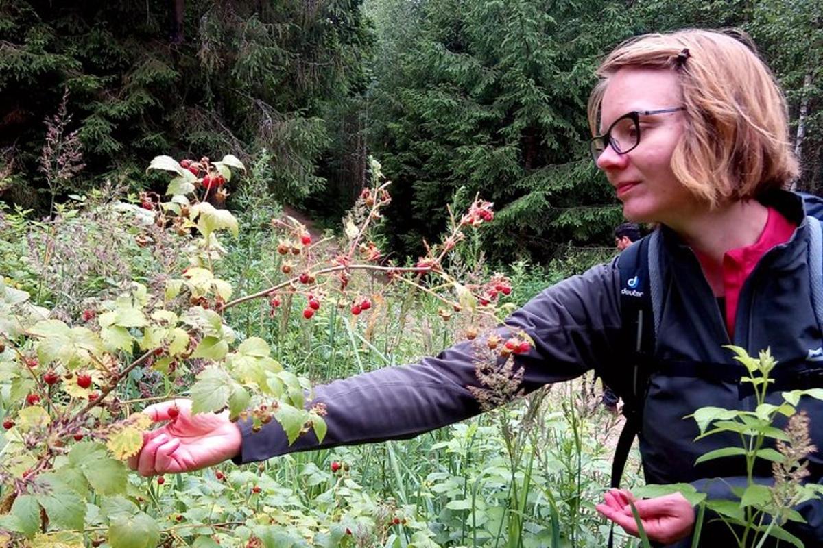 a woman standing in a field of flowers