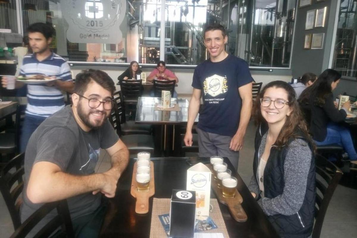 a group of people sitting at a table in a restaurant