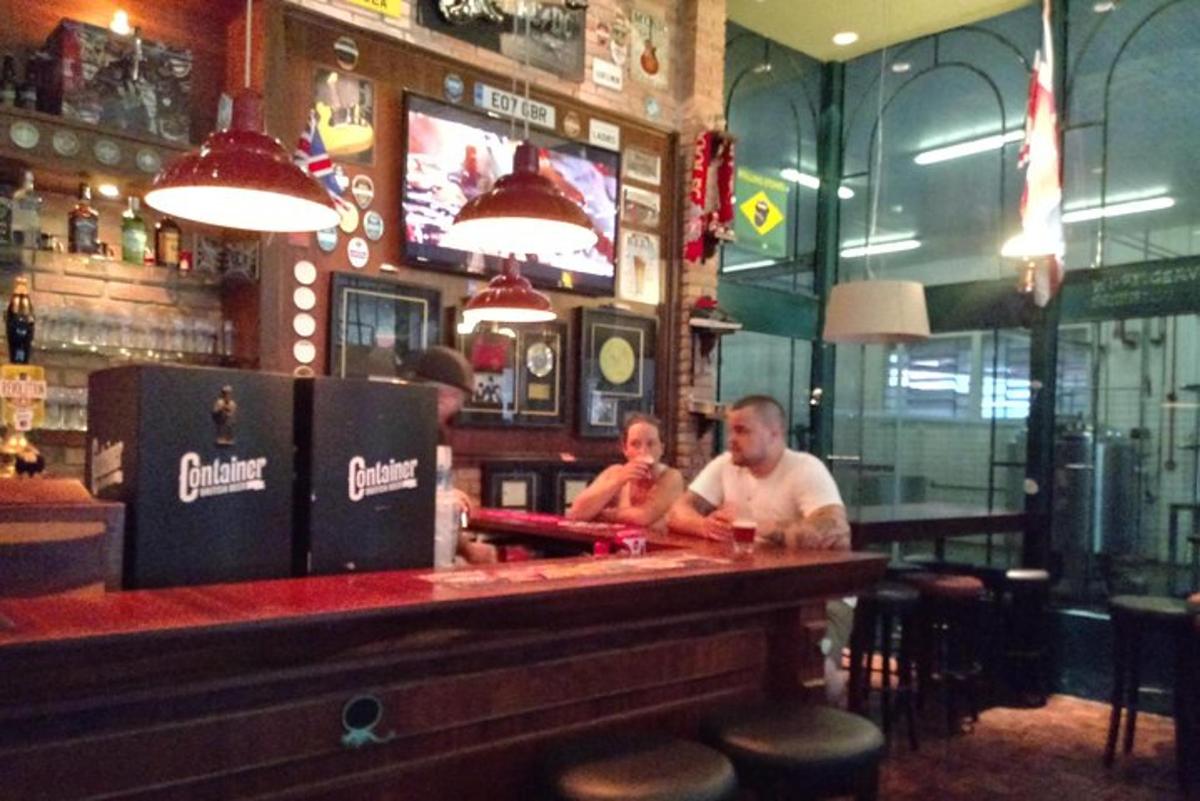 a man and a woman sitting at a bar