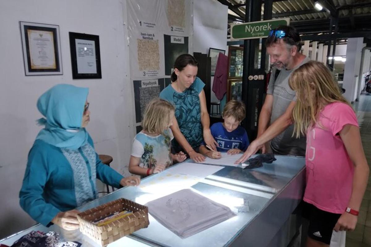 a group of people standing around a counter