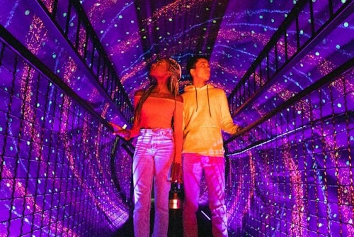 a man and a woman standing on a stage