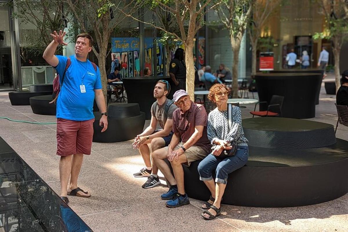 a man standing next to a group of people