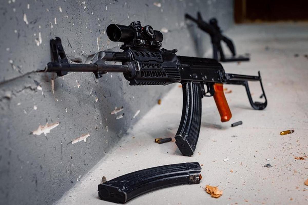 a gun on the side of a wall