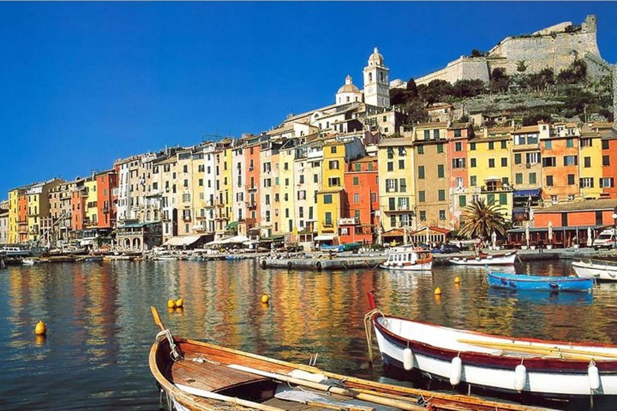 a group of boats in a harbor with buildings