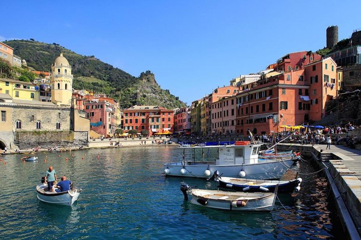 a group of boats in a river in a city