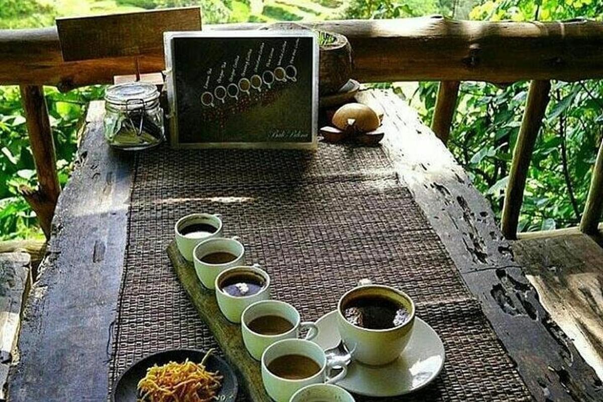 a table with cups of coffee and a box on it