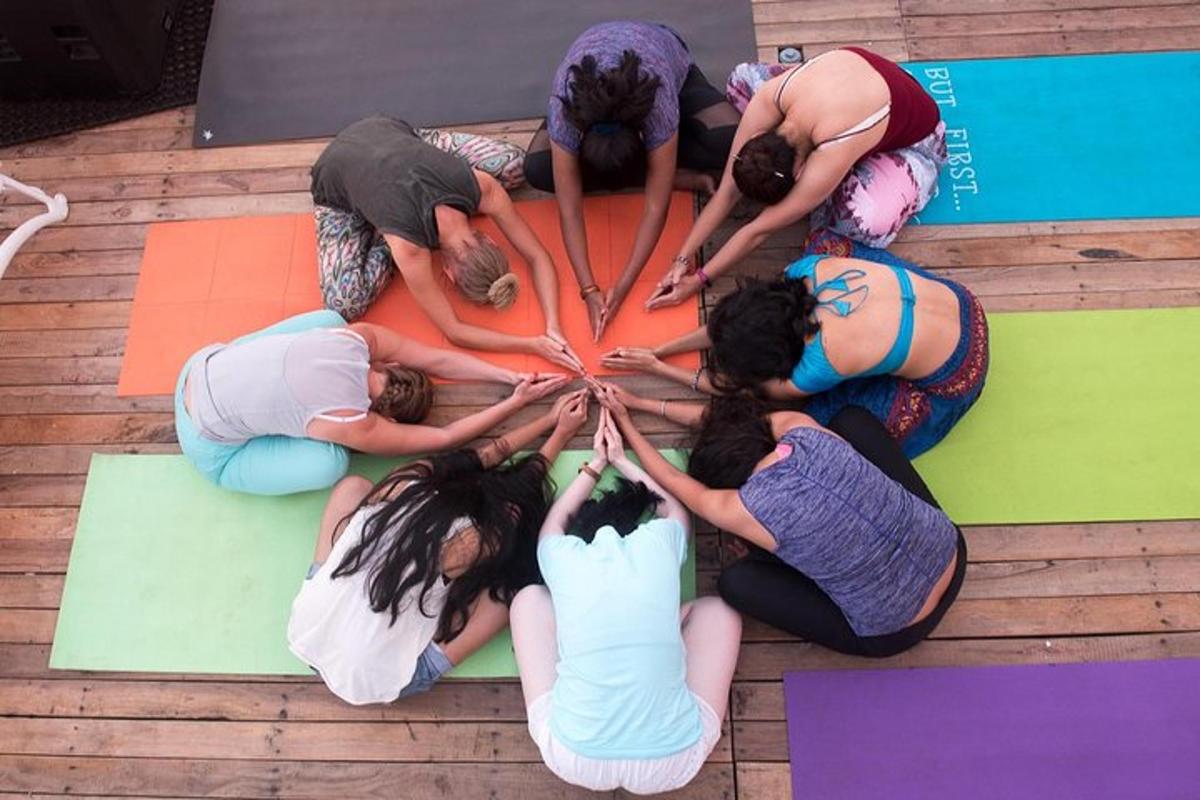 a group of people sitting in a circle on the floor