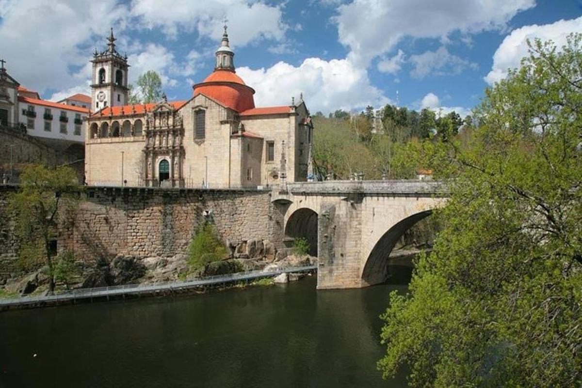 a bridge over a river in front of a building
