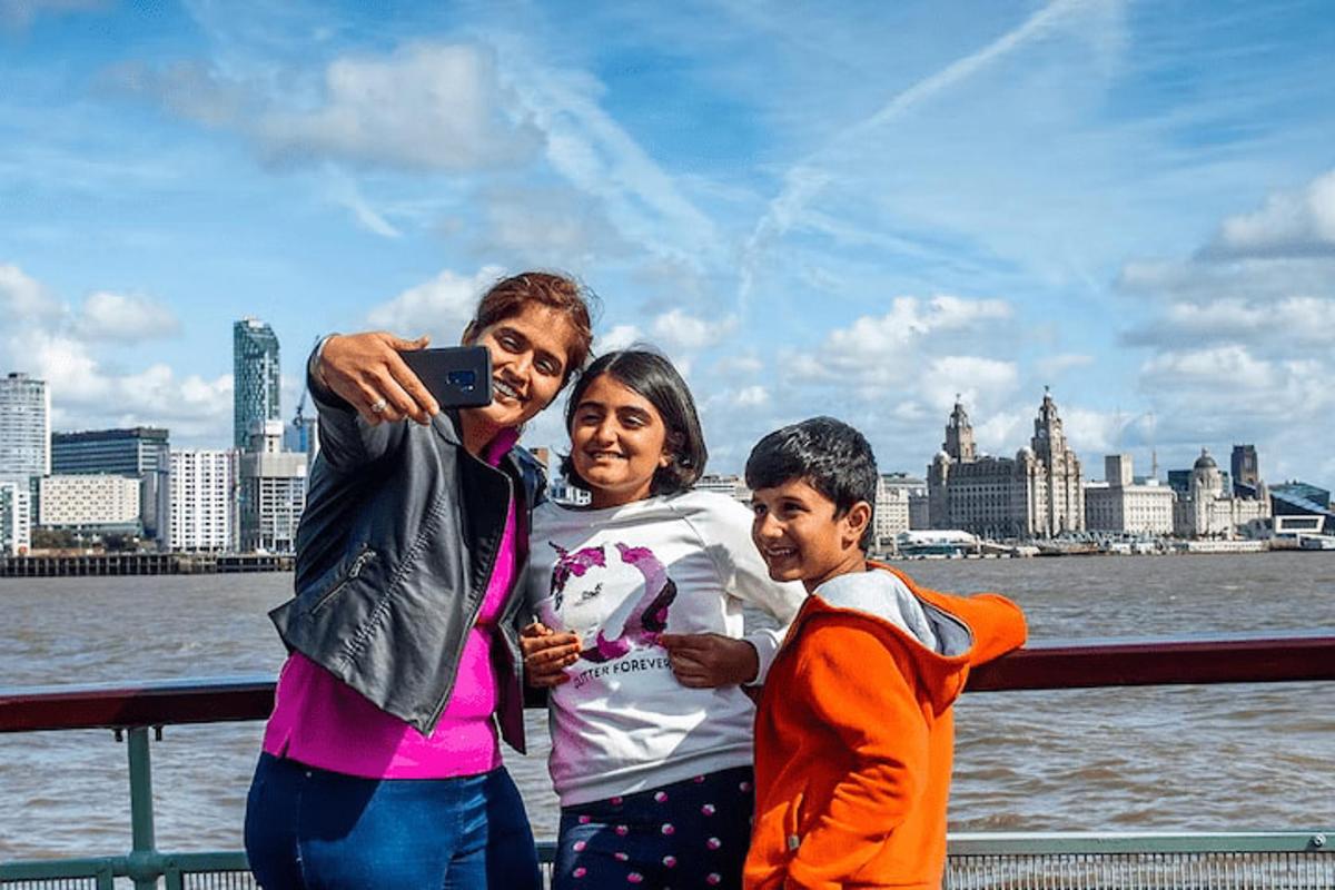a woman and two children are taking a picture