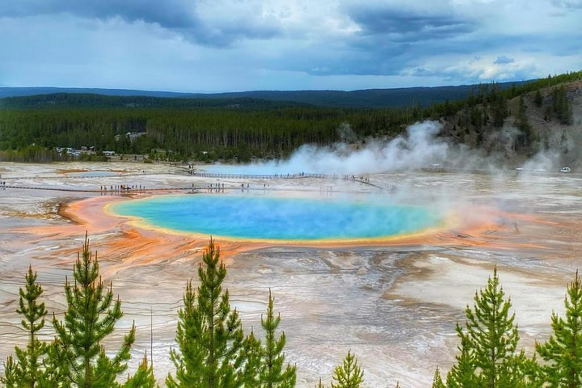 a colorful pool of water at a geyser