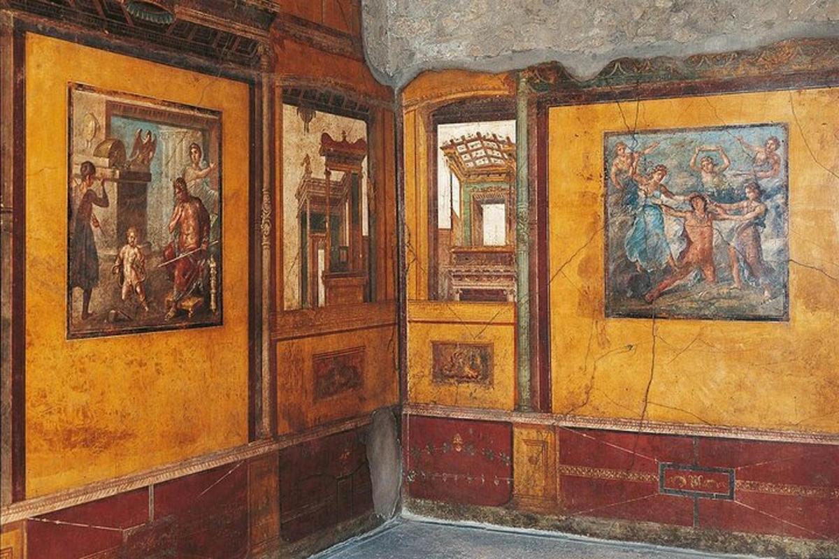 Una pintura de una habitación con pinturas en las paredes.