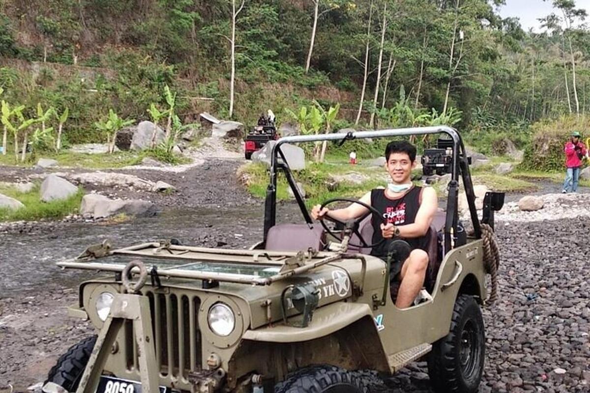 a man sitting in the back of a jeep