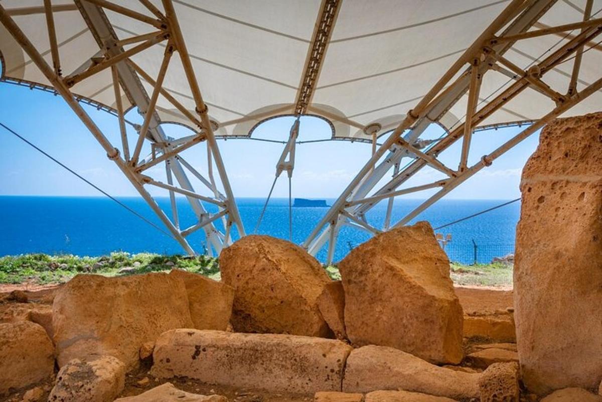 a group of rocks under a white umbrella