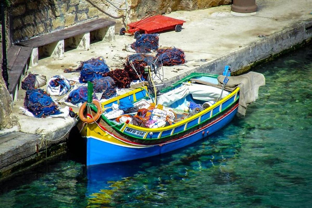 a blue and yellow boat sitting in the water