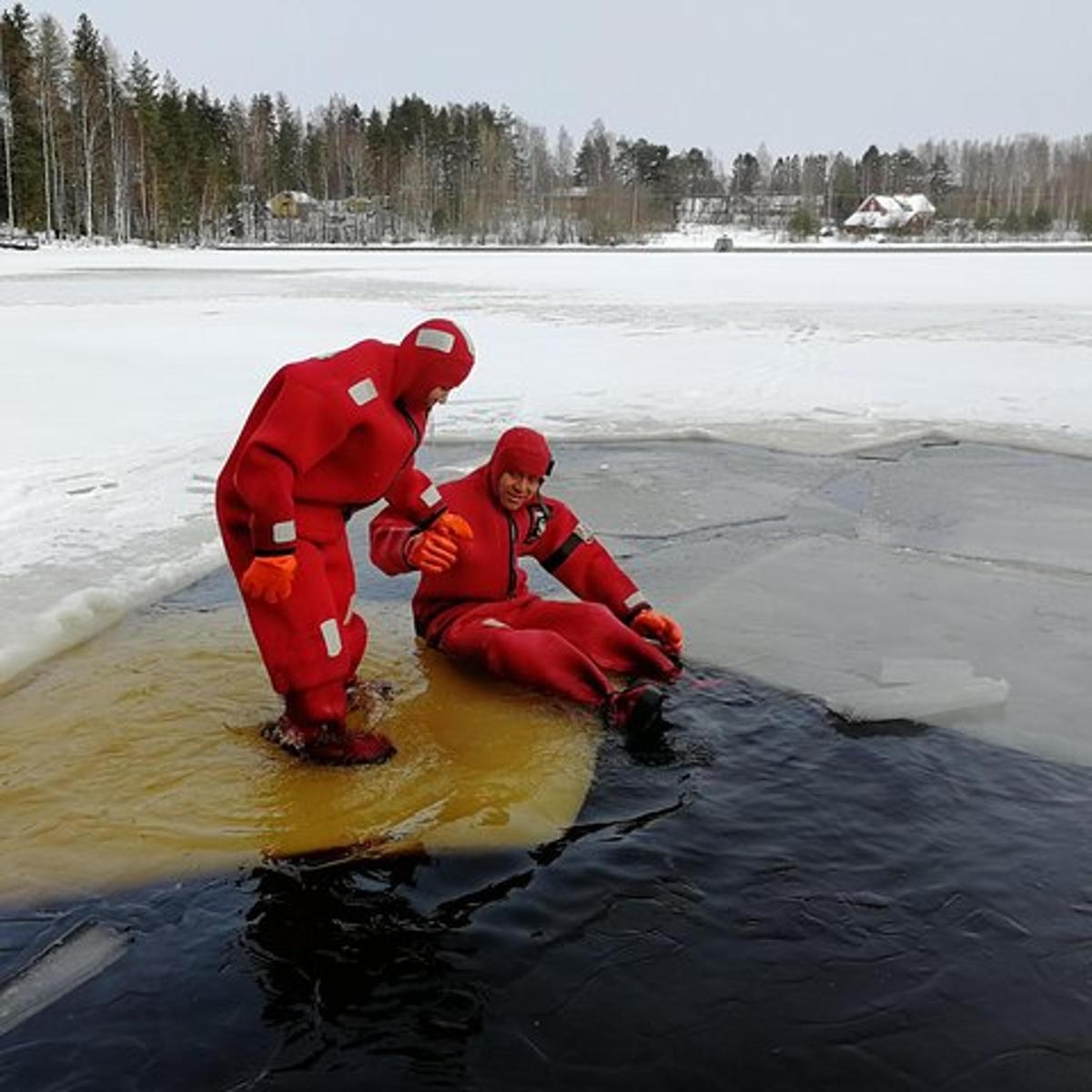 two people dressed in red are in the water