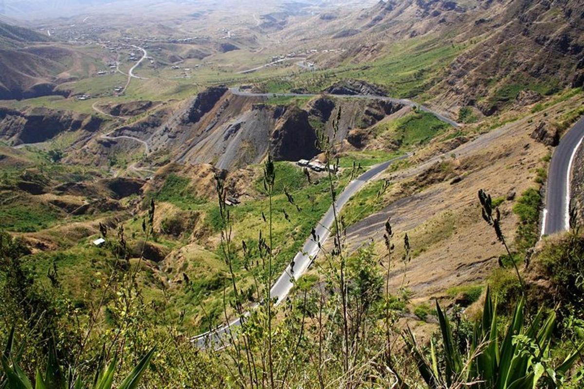 a winding road on the side of a mountain