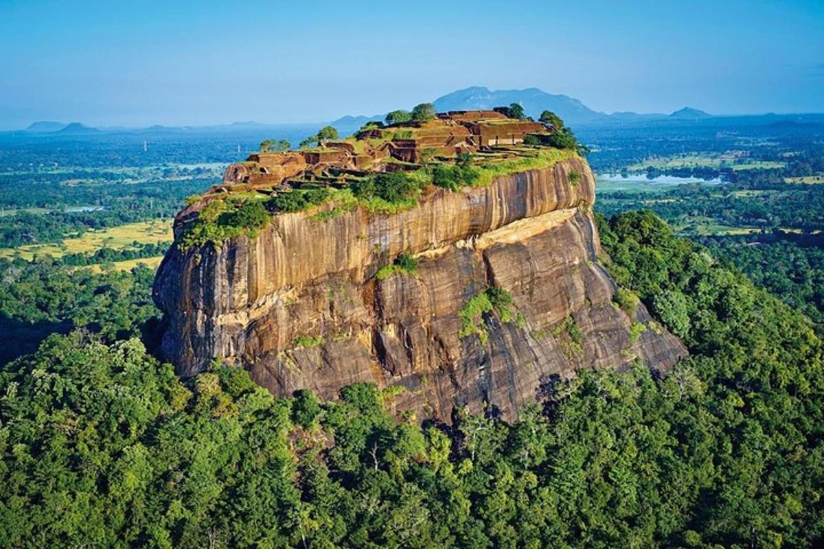 a mountain with a house on top of it