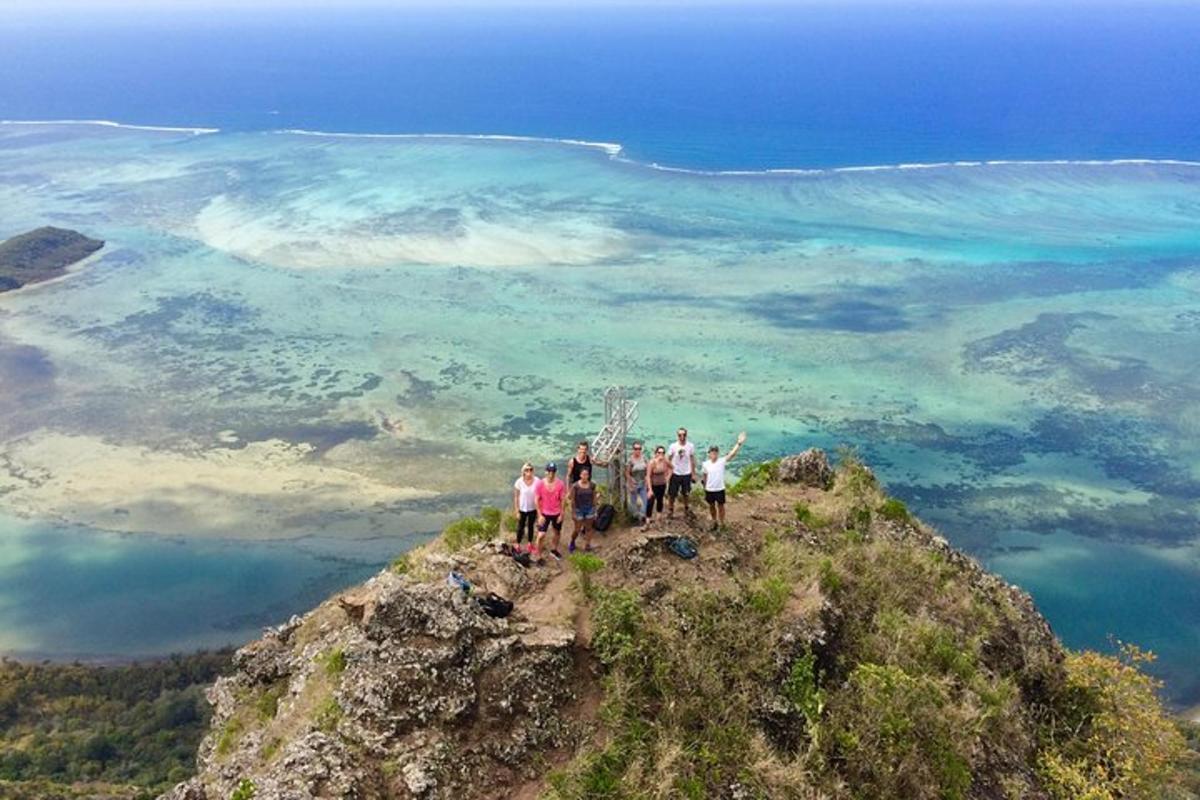 a group of people standing on top of a mountain