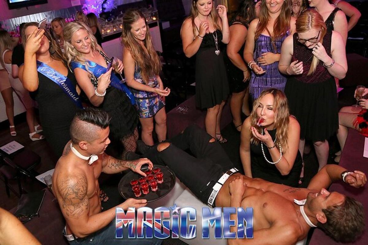 a man laying on the dance floor at a party
