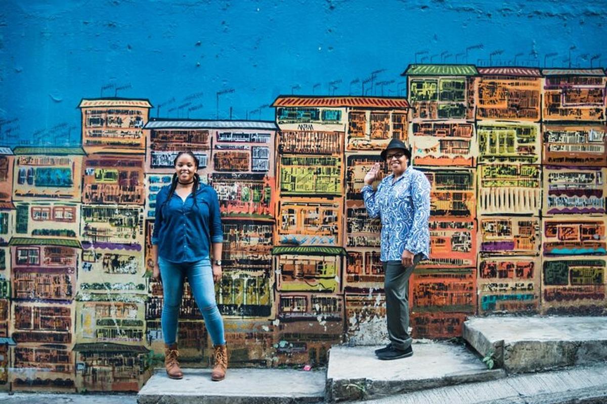 a man and a woman standing in front of a wall