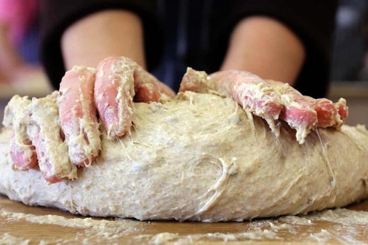 a close up of a piece of bread with meat on it