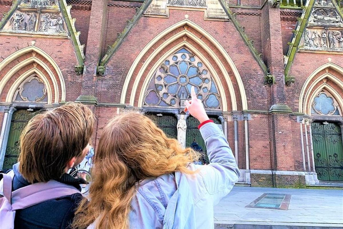 two women standing in front of a church