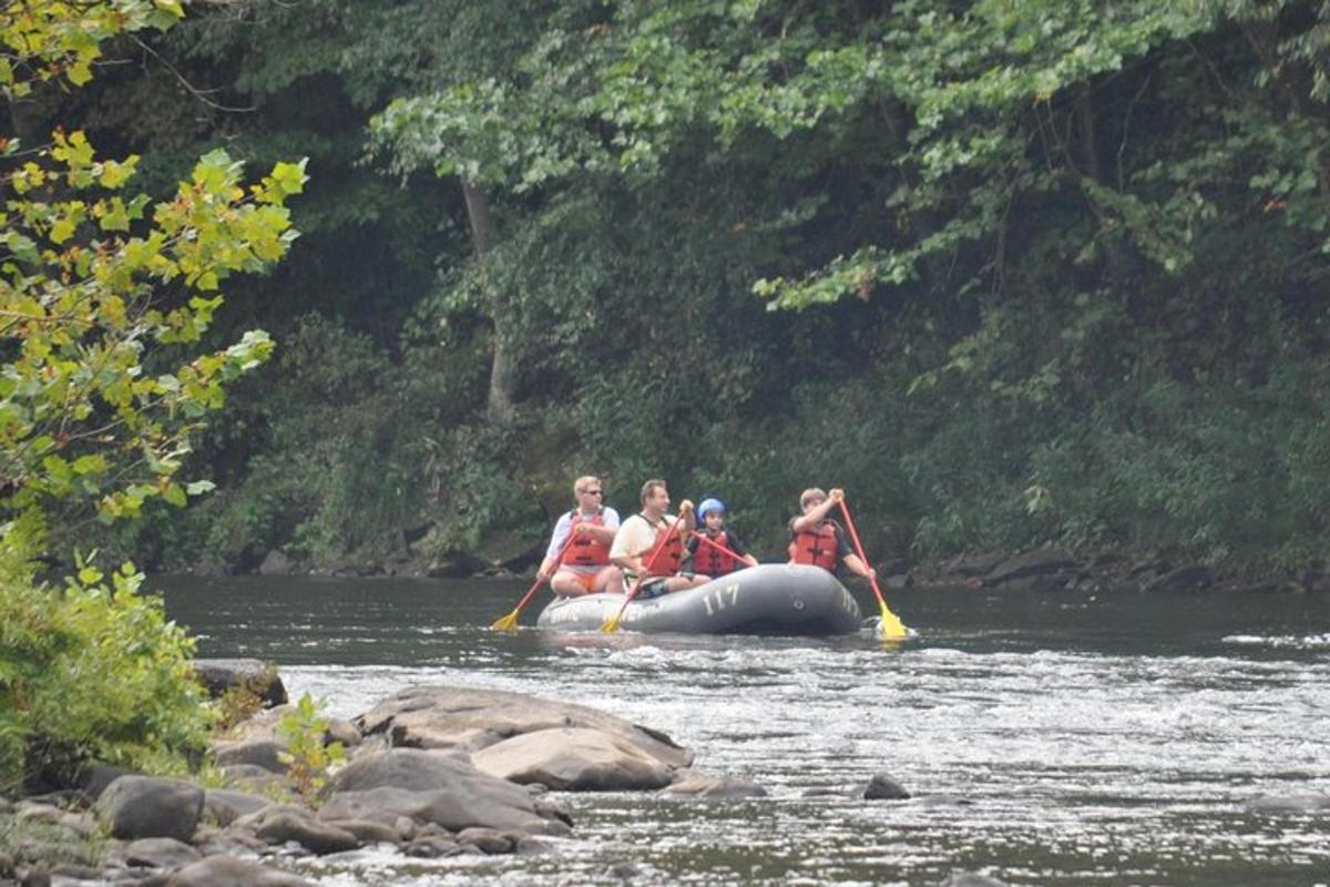 a group of people on a raft in a river