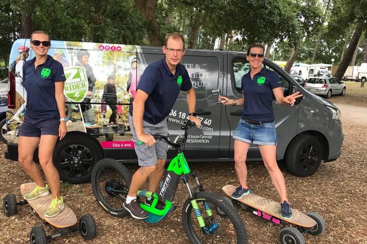 a group of three people standing on skateboards and scooters