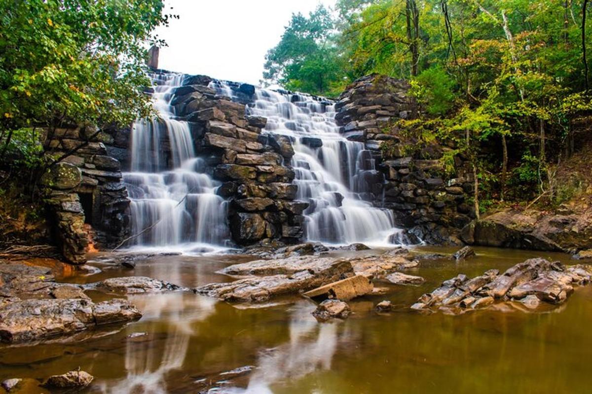 a waterfall in the middle of a river