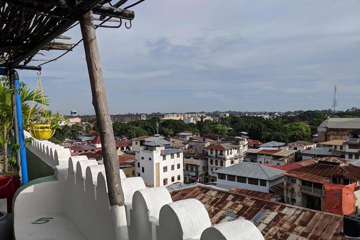 a view of a city from a white fence
