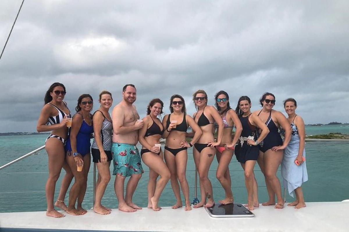 a group of people in bathing suits on a boat