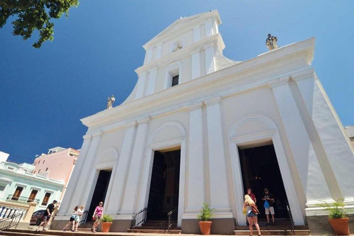 a white building with people standing in front of it