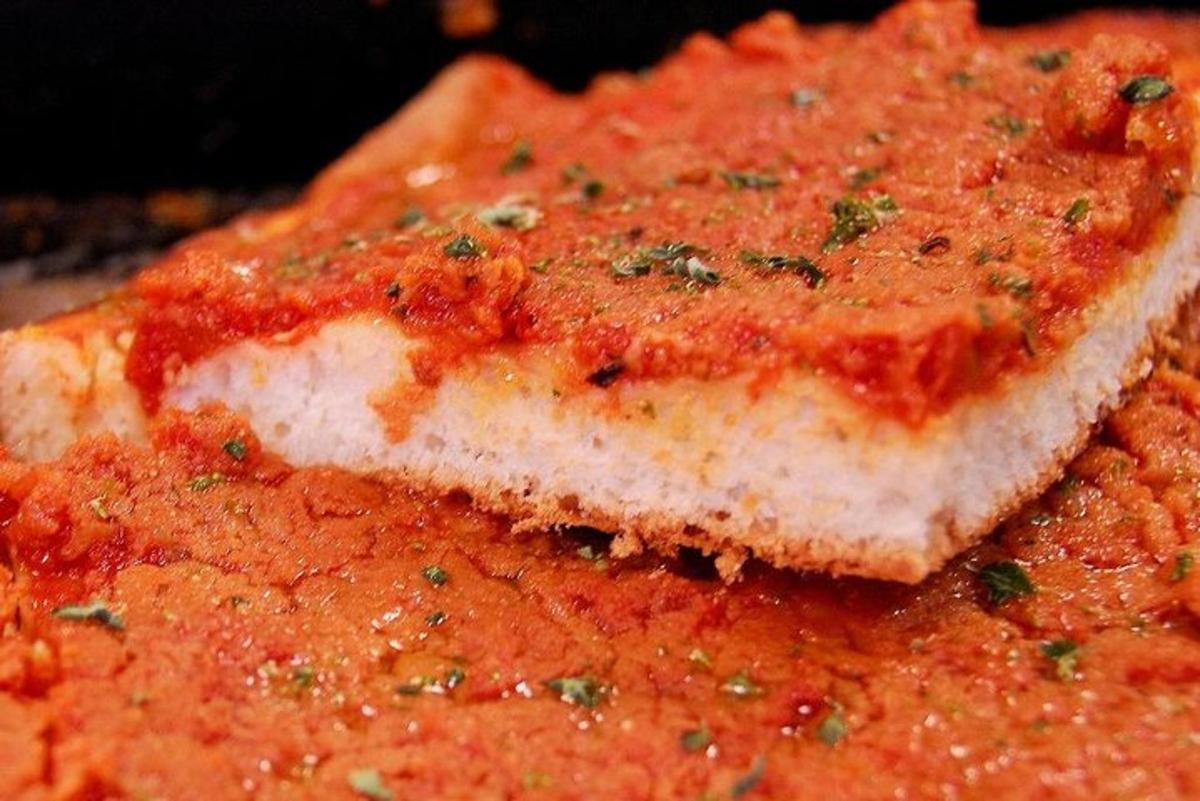 a close up of a piece of meat with sauce
