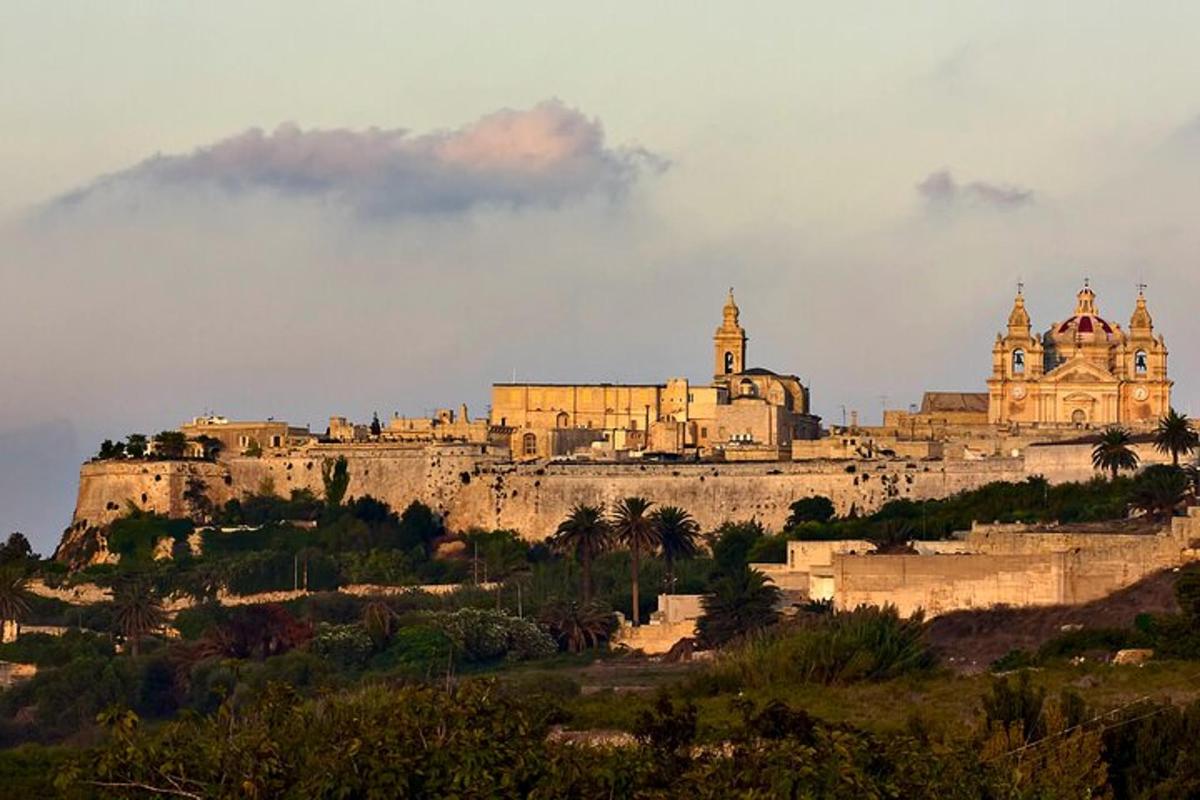 a building on top of a hill with a castle