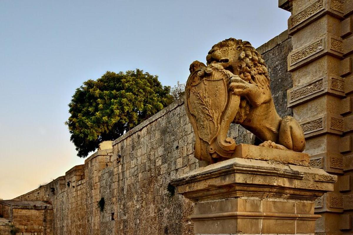 a statue of a lion on the side of a wall