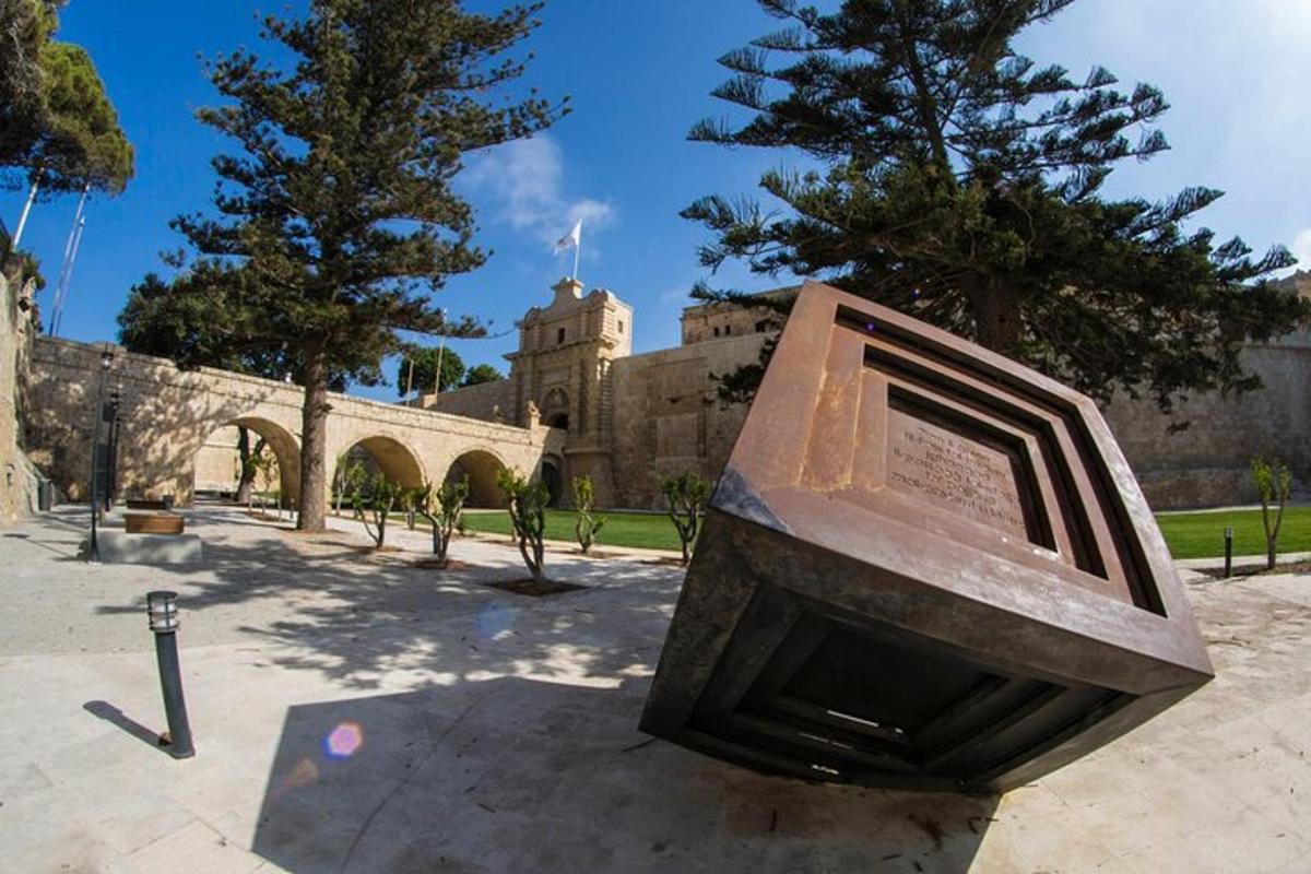 a statue of a television in front of a building