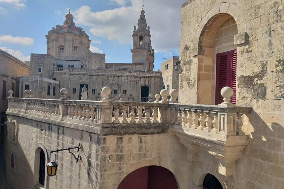 an old building with a bridge and two towers
