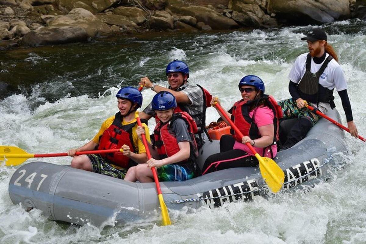 a group of people in a raft on a river
