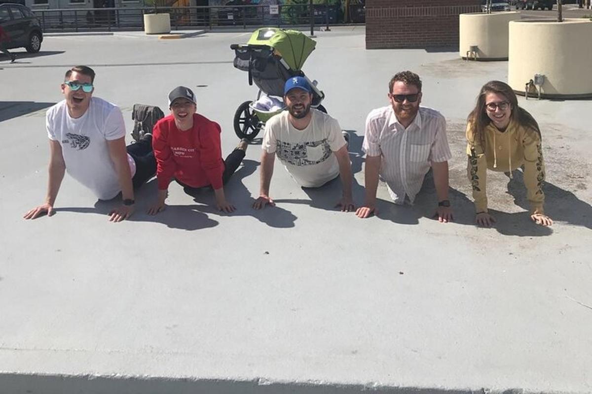 a group of people posing for a picture in the sand