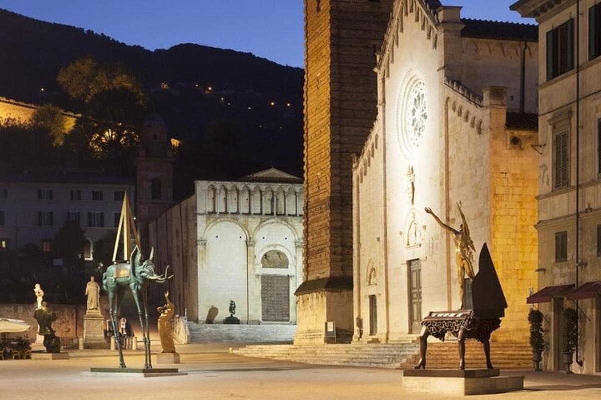 a large building with a statue in front of it