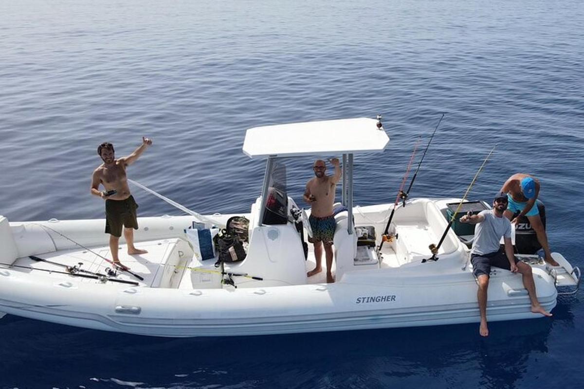a group of people on a boat in the water