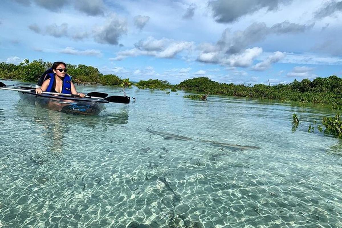 a woman is in a boat in the water