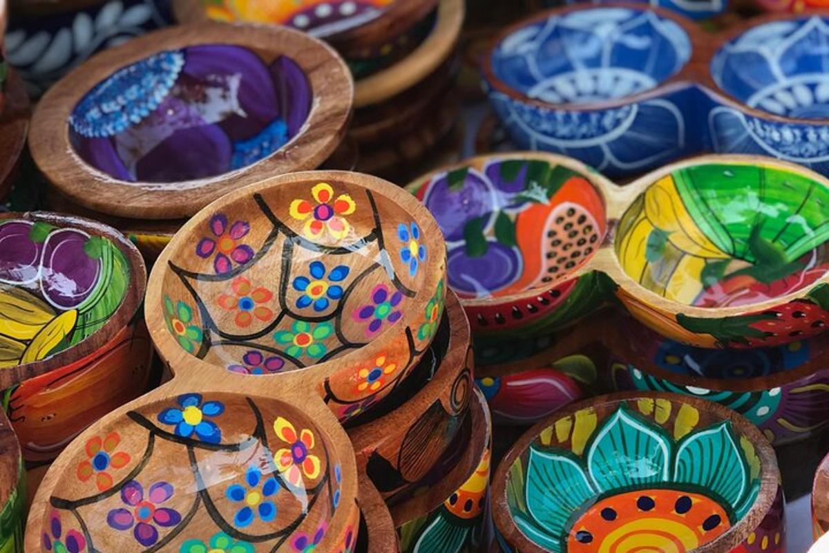 a display of colorful bowls with flowers on them