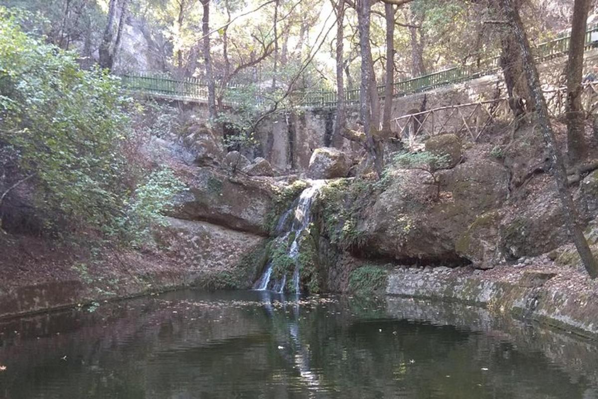 a small waterfall in the middle of a river