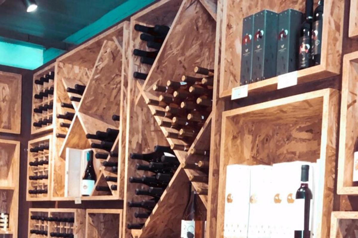 a room filled with lots of wine bottles